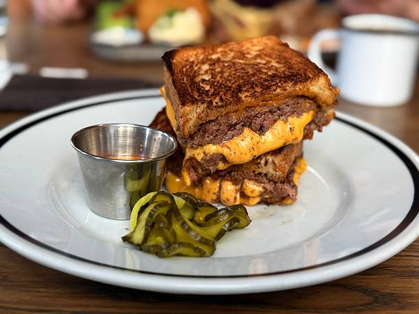 istock Cheesy grilled beef sandwich with pickles and sauce 2237151794