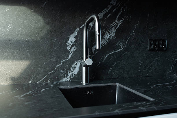 istock Modern black kitchen sink with minimalist faucet 2237155589