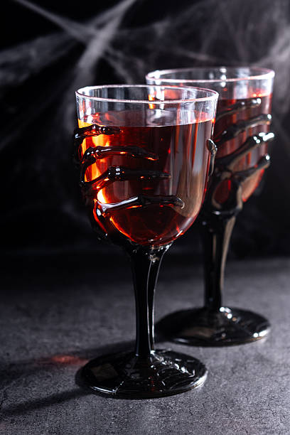 istock Halloween spooky red cocktail in skeleton hand glass 2237156710