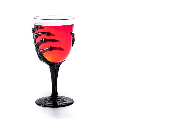istock Halloween spooky red cocktail in skeleton hand glass 2237156862