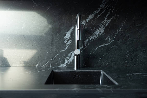 istock Modern black kitchen sink with minimalist faucet 2237159978