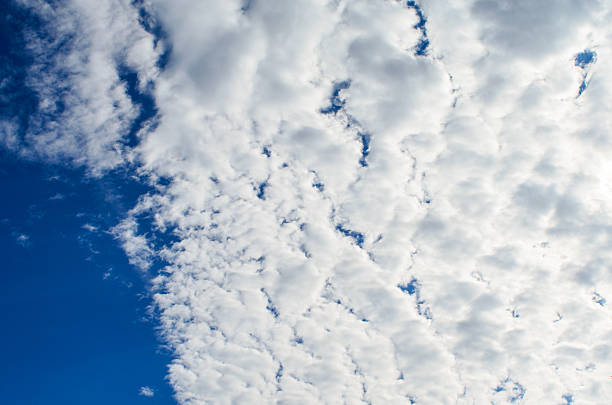 Beautiful blue sky with white cumulus clouds in daylight