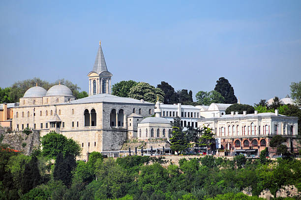 Fatih district, Istanbul, East Thrace, Turkey: Topkapı Palace, was the primary residence and administrative center of Ottoman sultans from its construction in 1459 under Mehmed II until the mid-19th century, when the court moved to Dolmabahçe Palace. Built over a Byzantine acropolis and the Roman city of Byzantion, overlooking the Bosphorus and Golden Horn, this sprawling complex includes four main courtyards, the Harem, imperial treasury, and sacred relic collections, showcasing a blend of Ottoman, Byzantine, and Islamic architectural styles.