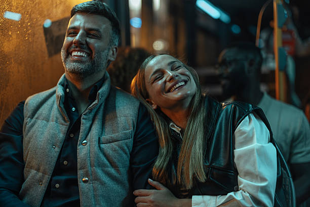 istock Couple enjoying their ride on a late night bus 2237169921