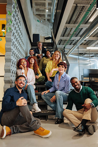 istock Diverse business team smiling and relaxing on office stairs 2237169925