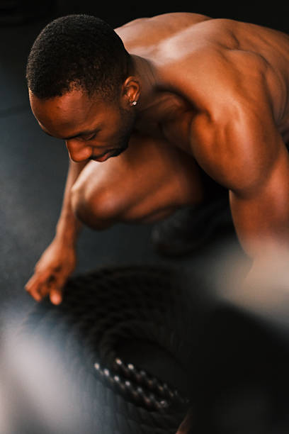 istock Smiling Athlete doing a Workout in Gym 2237175592