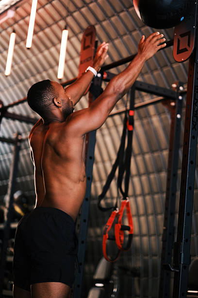 istock Smiling Athlete doing a Workout in Gym 2237177333
