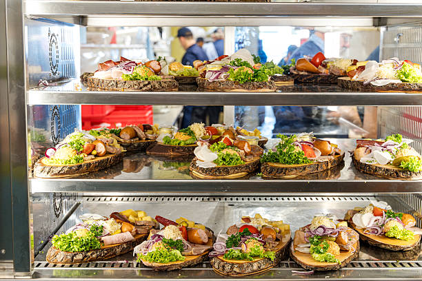 istock Assorted Open-Faced Sandwiches On Rustic Bread Shelves At A Munich Market Stand During Volksfest 2237180383