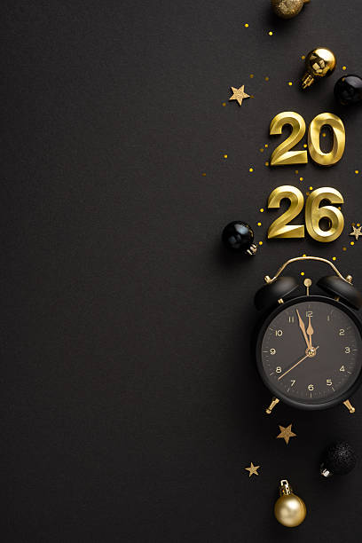 istock Vertical flat lay of golden new year 2026 elements, including a clock and festive items 2237187098