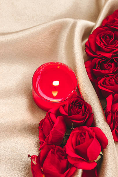Romantic setting with red roses and candlelight for a special occasion