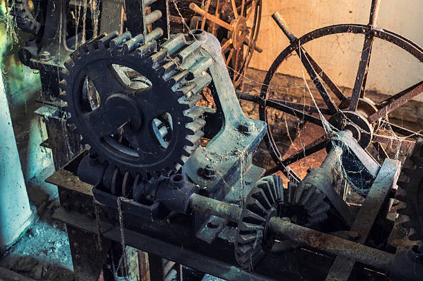 Old machinery and gears in an abandoned spooky building.
