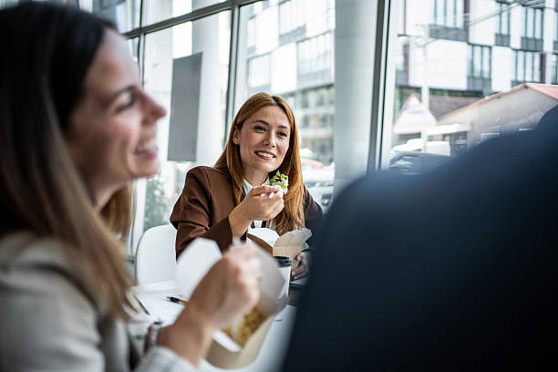 istock Businesswomen having lunch break in modern office building 2237188237