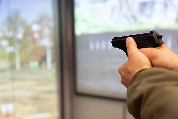 istock Men's hands training in shooting with a gun 2237188412