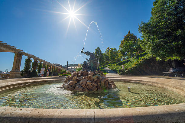 Budapest, Central Hungary - September 20, 2025: Beautifully sculpted fountains, even more beautiful to see at night, and splendid gardens to stroll through. The Triton Fountain (1881, 2014) was restored in the neo-Renaissance garden of the renovated Várkert Bazaar facing the Danube.