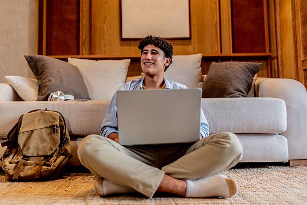 istock Teenage boy using laptop at home 2237193062