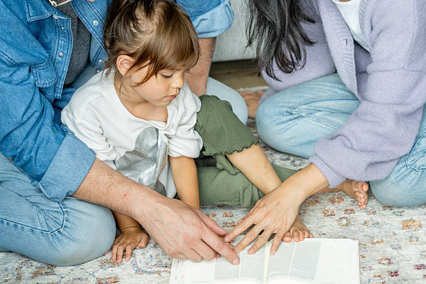istock Warm Family Reading Moment On Rug With Open Book, Shared Discovery And Bonding 2237193413