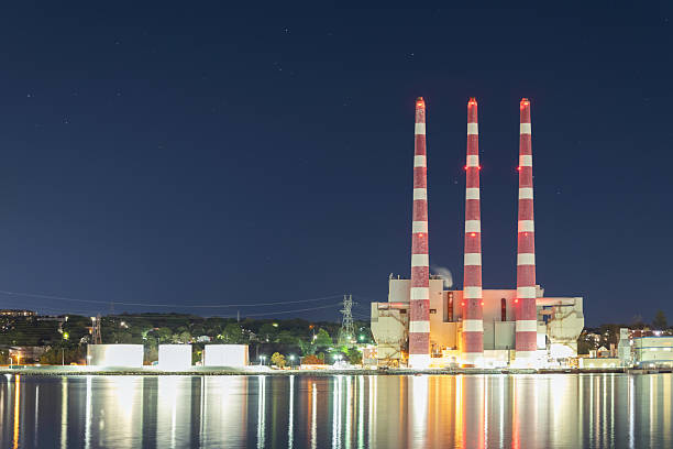 Seaside natural gas powered power station at night.