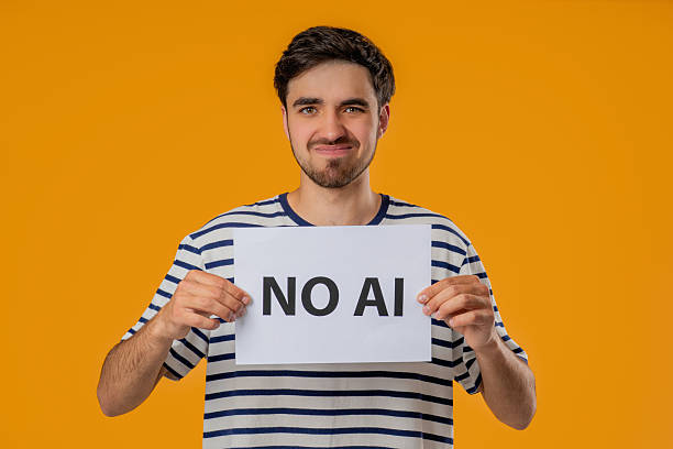 istock Young Man Holds Sign No Ai With Serious Face In Studio Visual Protest Against 2237194773