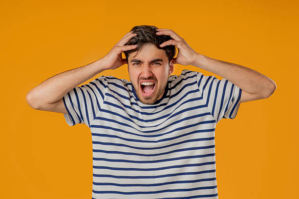 istock Stressed angry man Shouting, Guy In Shock on Yellow. Panicked facial expression 2237194824