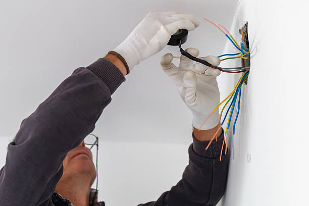 istock Using electric tape to cover exposed wiring. 2237199062