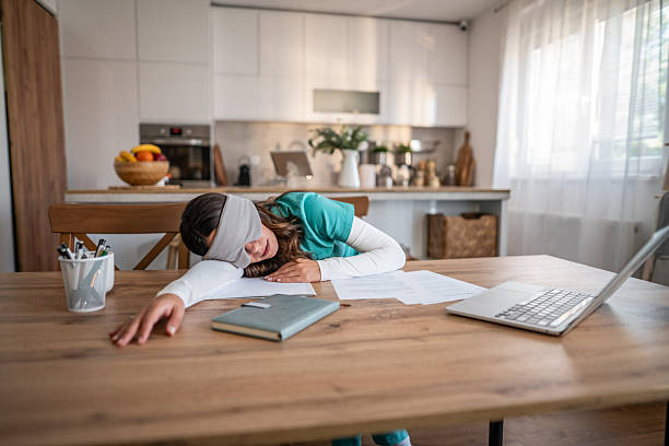 istock Woman sleeping at desk during work from home burnout 2237208204