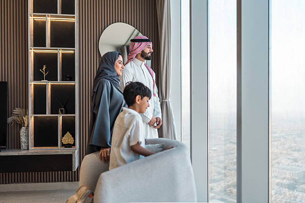 istock Diverse Arabic Family Enjoying Panoramic Riyadh View from Modern Home 2237212548