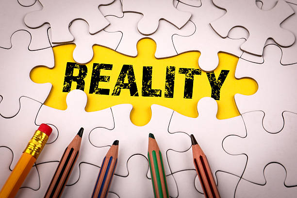 istock Word REALITY revealed under missing puzzle piece with colored pencils around. Symbolizing truth, perspective, problem solving and understanding 2237214633