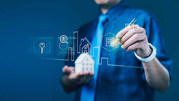 istock Businessman using digital interface with house and contract icons for online property platform and smart real estate solutions 2237216294