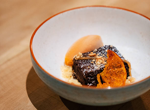 Chocolate Brownie Dessert with Ice Cream and Candied Orange