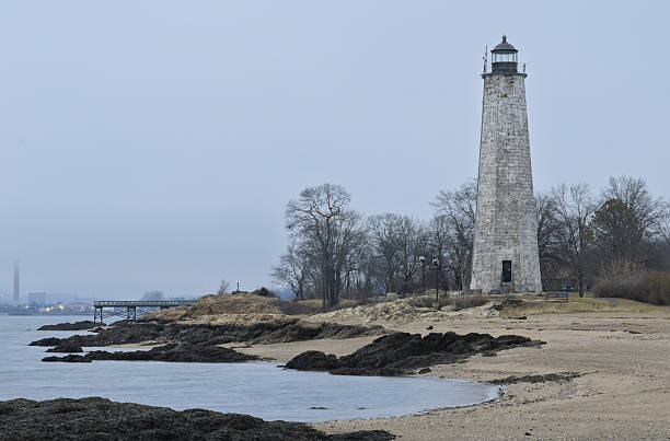istock Rocky Island Lighthouse Standing Tall Amidst Turbulent Ocean. 2237217377