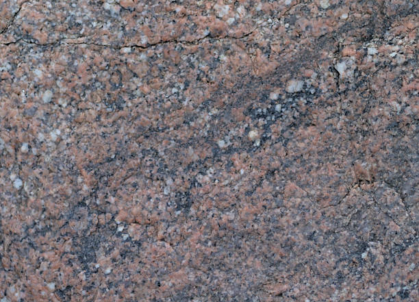 istock Rough-textured Red Granite With Vibrant Color Variations. 2237218859