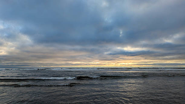 istock Side view from a wet beach westward towards the pacific ocean 2237220494