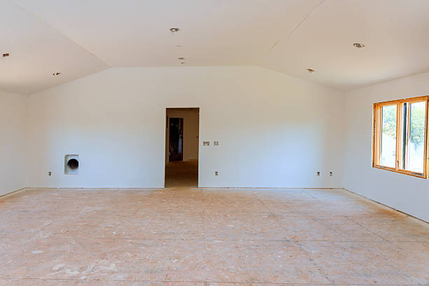 istock Spacious empty room with large windows unfinished flooring being prepared for interior design 2237226423