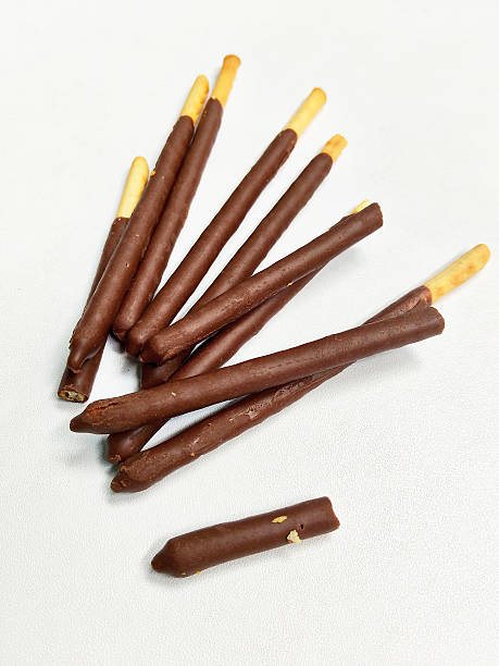 istock Crispy Chocolate Dipped Biscuit Sticks on a White Background 2237230074