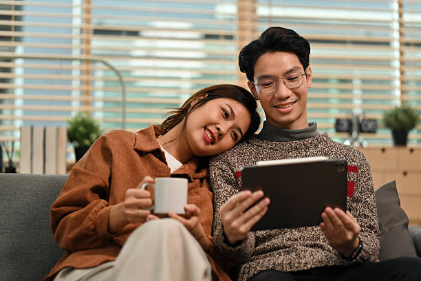 istock A Relaxed Asian Couple Enjoying Digital Time Together 2237232660