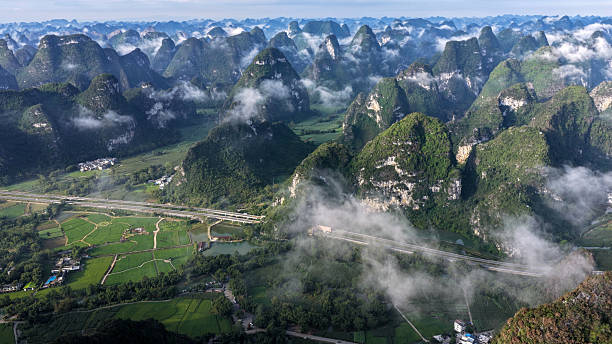 istock Majestic Karst Mountains and Countryside Fields 2237233312