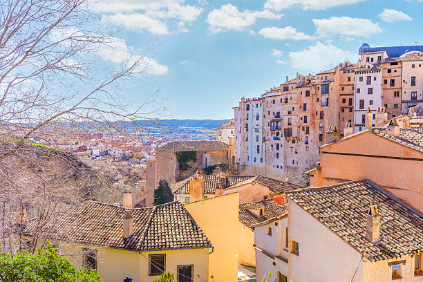 istock Cuenca houses hanging from cliff in spain with valley and blue sky 2237234560