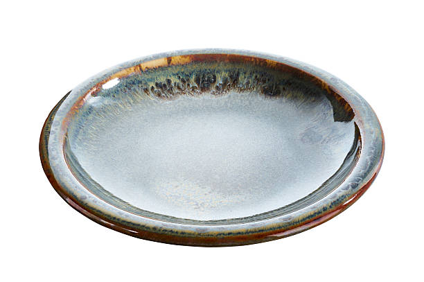 istock Rustic Ceramic Plate with Blue and Brown Reactive Glaze, Side Angle View, Isolated on White Background with Clipping Path 2237234893