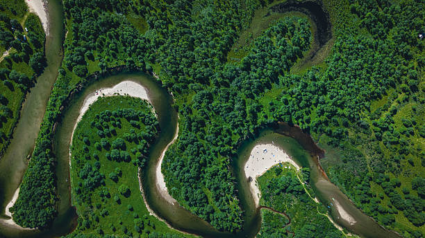 istock Idyllic Snake Beach from above surrounded by forest 2237239215