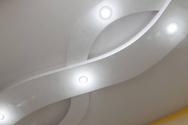 istock Soft, architectural curves and recessed lighting create a calm, minimalist interior 2237243328