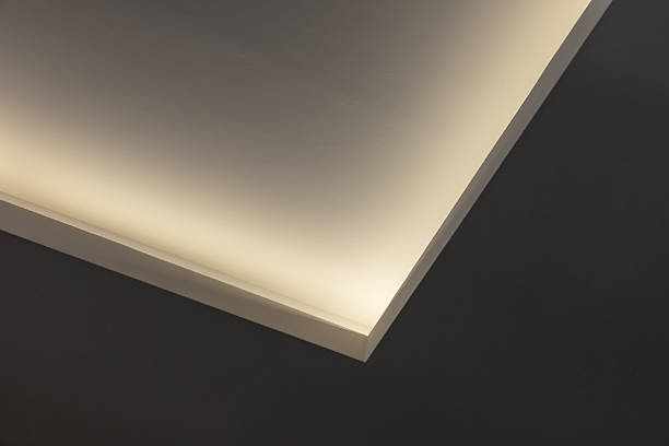 istock A minimalist interior close-up shows warm indirect lighting along an angled ceiling 2237243334