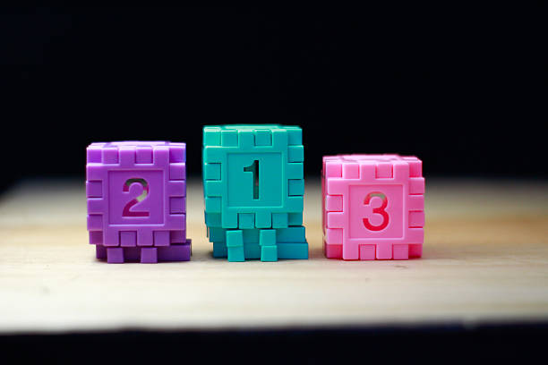 Close-up image showing educational toys for children, symbolizing learning, counting, mathematics, early education, and creativity. Bright and playful composition suitable for concepts of childhood development, number learning, and preschool education.