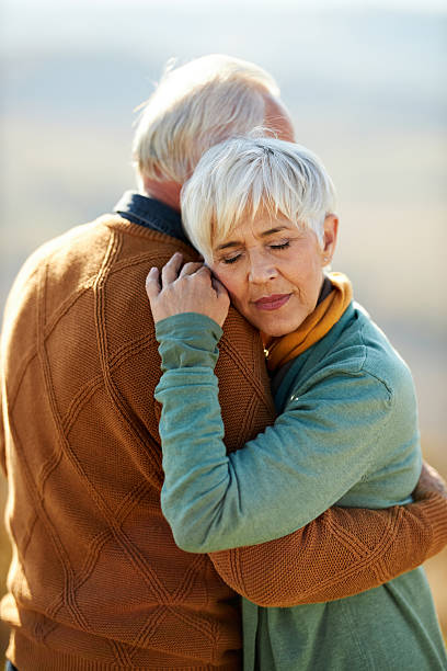istock Affectionate senior couple embracing in autumn day. 2237248305