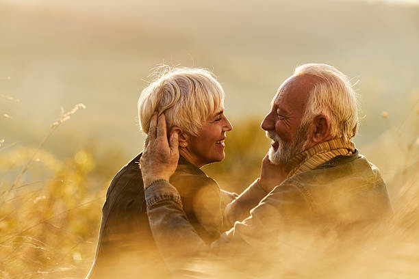 istock Happy senior couple talking during autumn day on a hill. 2237248604