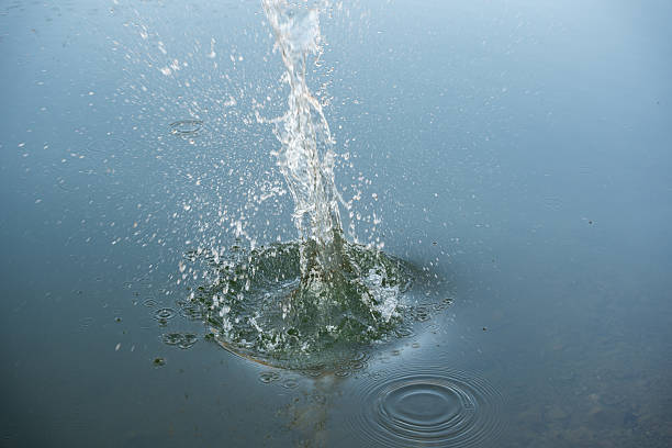 istock Circular water ripples and bubbles effect. Water ripples and round droplets on blue sea texture pattern background. Liquid motion on calm lake surface. Ring effect, circles 2237249189