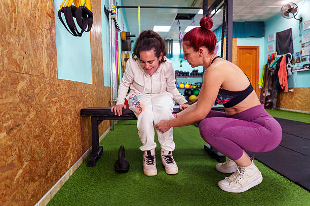 istock Woman with cerebral palsy training with personal trainer 2237250005