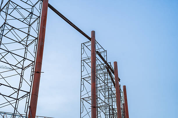 istock workers are working on large construction sites and many cranes are construction of building with blue sky background, Industry new building business. 2237251338