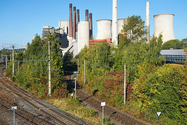 Heavy Industries - Large Power Plant Complex with Tall Chimneys and Storage Facilities