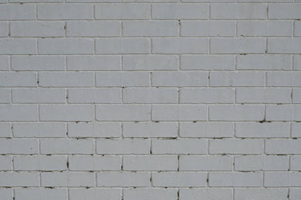 istock Close-up of brick wall painted with white 2237255571
