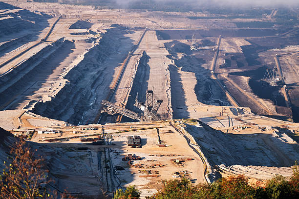 Heavy Industries - Expansive Open-Pit Mine with Terraced Excavation Levels and Massive Industrial Machinery